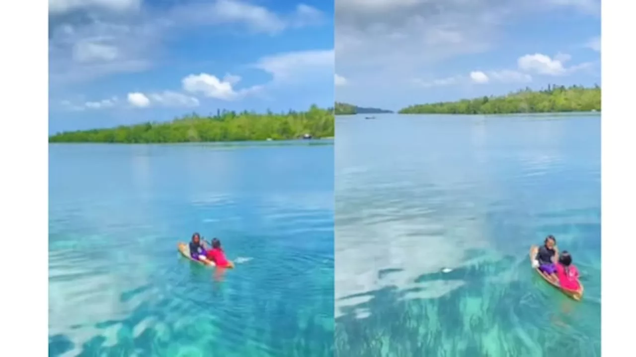 Viral! 2 Anak Perempuan Dayung Perahu Kecil di Pulau Bacan, Pemandangan Alamnya Bikin Kagum!