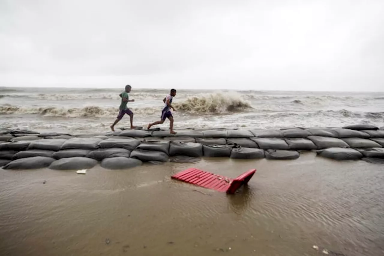 Cyclone floods coastal villages and cuts power in Bangladesh, where 800,000 had evacuated