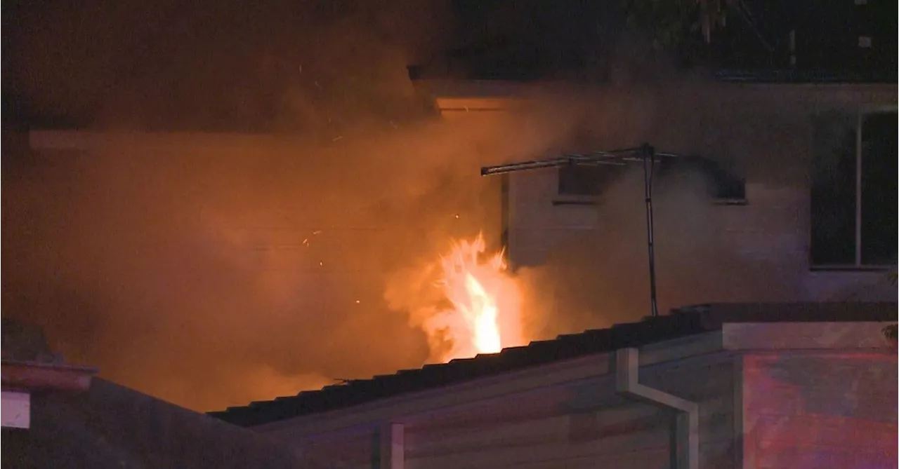 Ten people escape blaze in two-storey Sydney home overnight