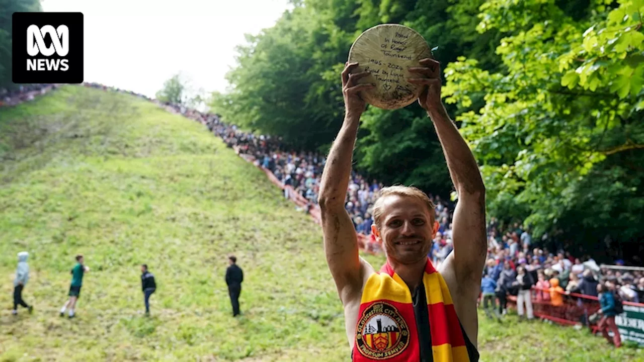 Australian man tumbles to victory in adrenaline-fueled Double Gloucester cheese-rolling race in England