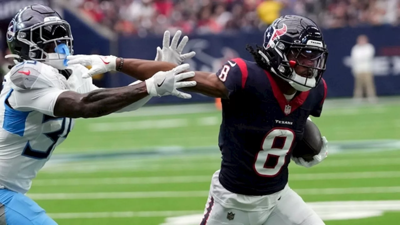 Houston Texans wide receiver John Metchie III receives the George Halas Award