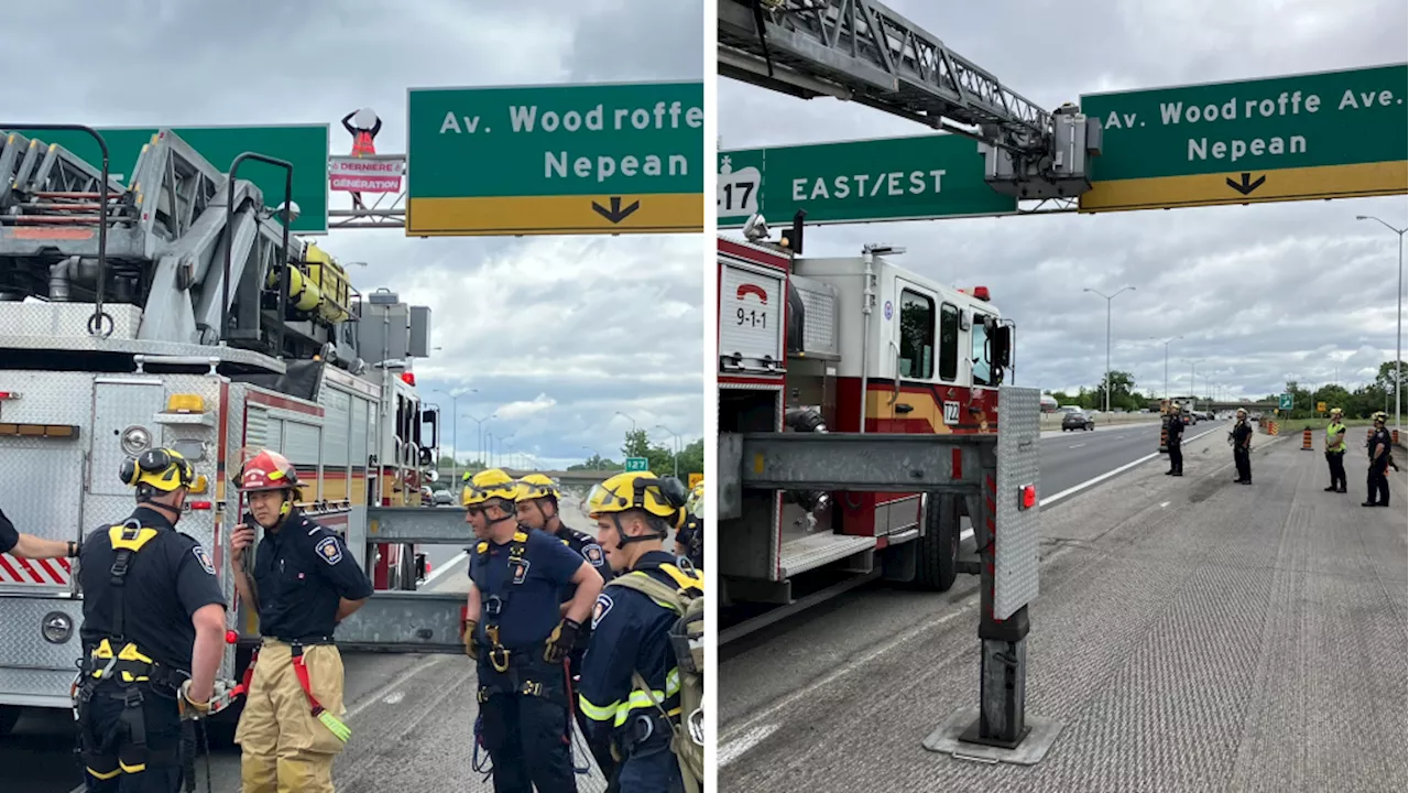 Ottawa firefighters, police bring down protesters from Hwy. 417 signs, causing delays