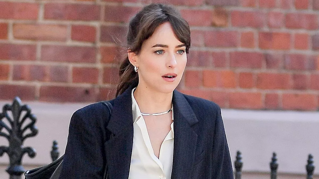 Dakota Johnson puts on a leggy display in a miniskirt