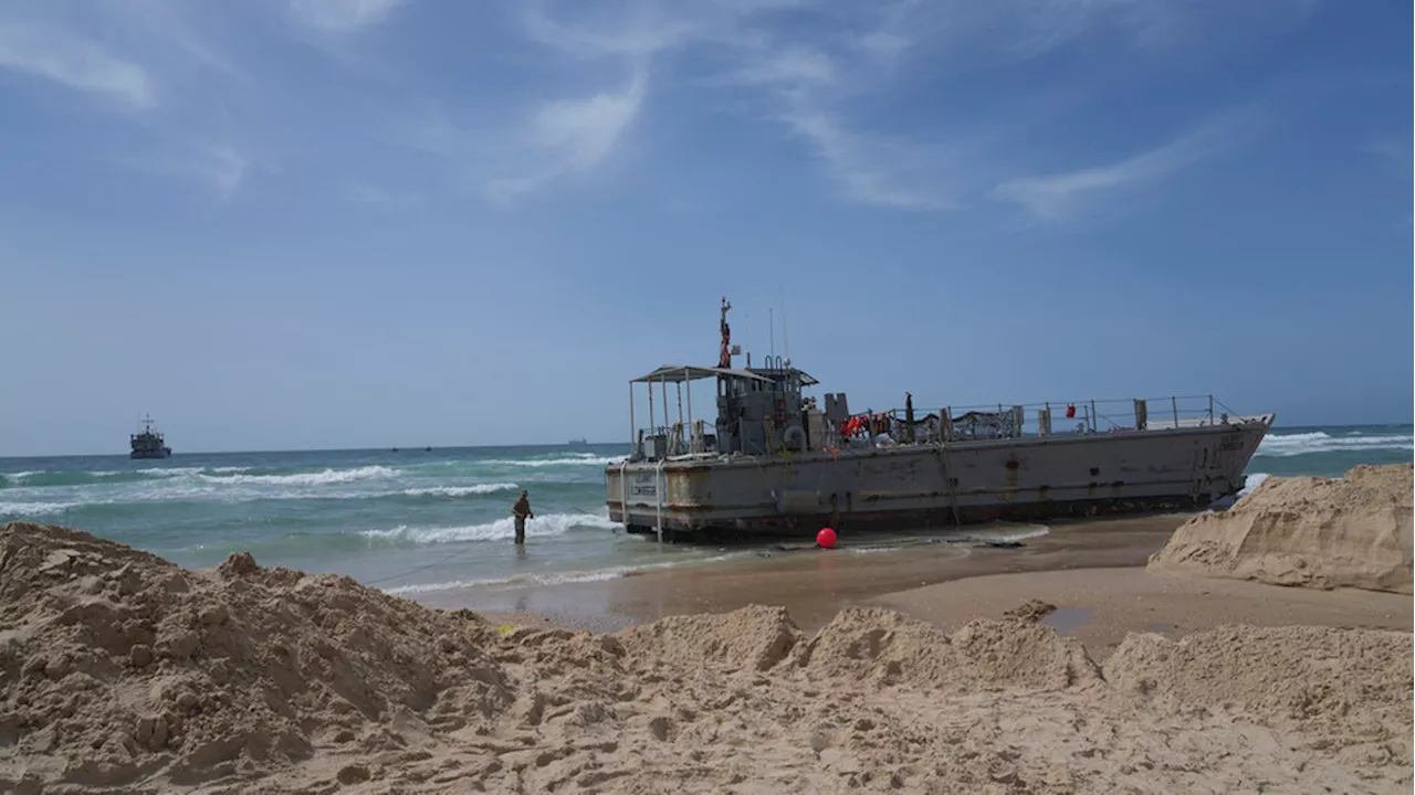 Aid deliveries suspended after rough seas damage US-built temporary pier in Gaza