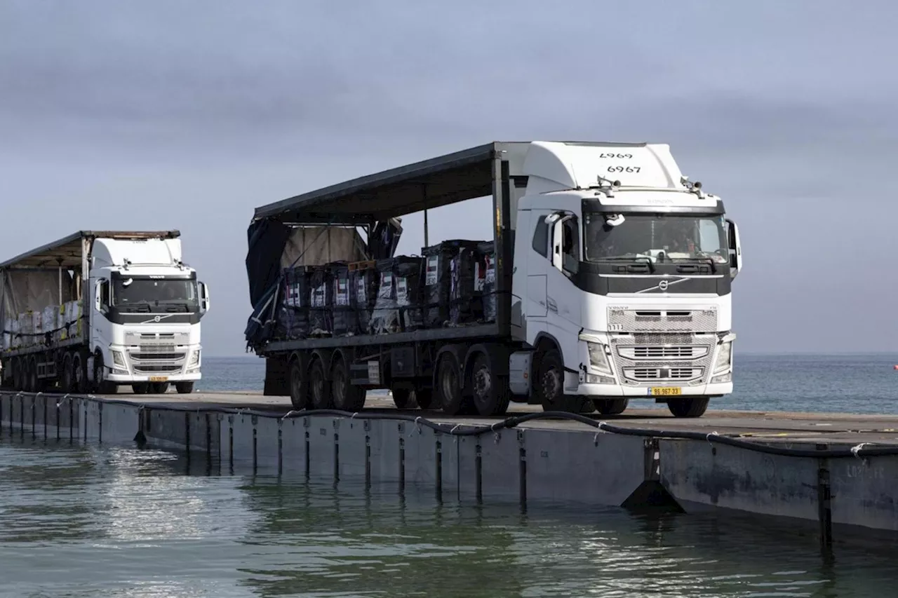 Aid deliveries suspended after rough seas damage US-built temporary pier in Gaza, US officials say
