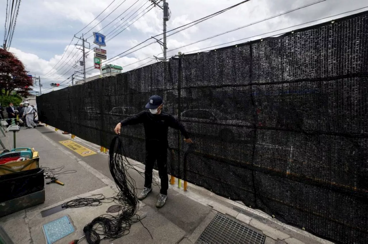 Holes poked in Mount Fuji tourist barrier