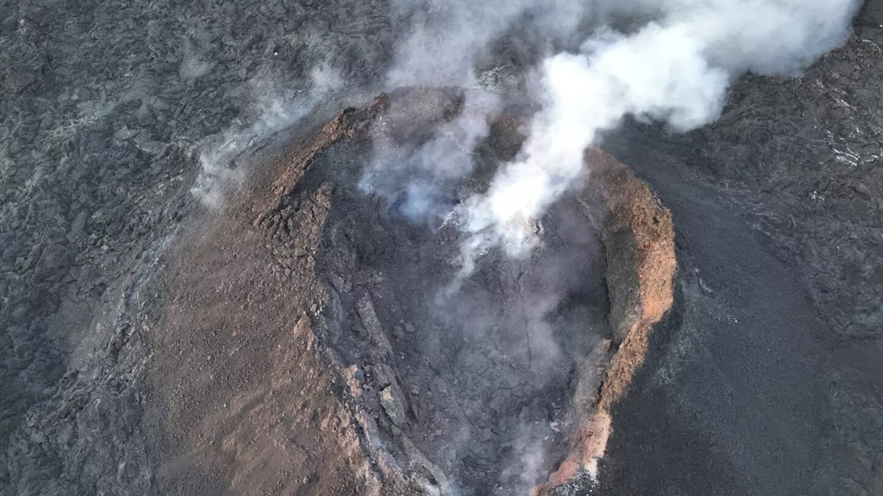 An Iceland volcano starts erupting again, spewing lava into the sky