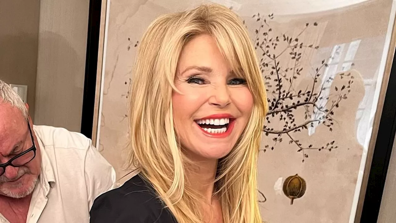 Christie Brinkley appears to go without UNDERWEAR as she flashes her backside while getting her...