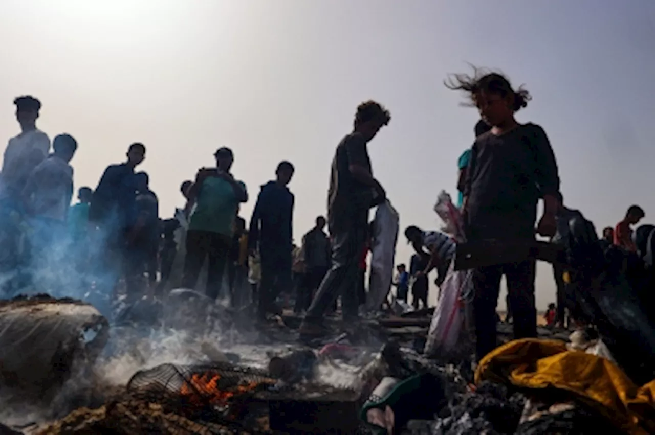 Gaza camp hit by deadly strike as Israel denies involvement, civil defence reports 21 dead