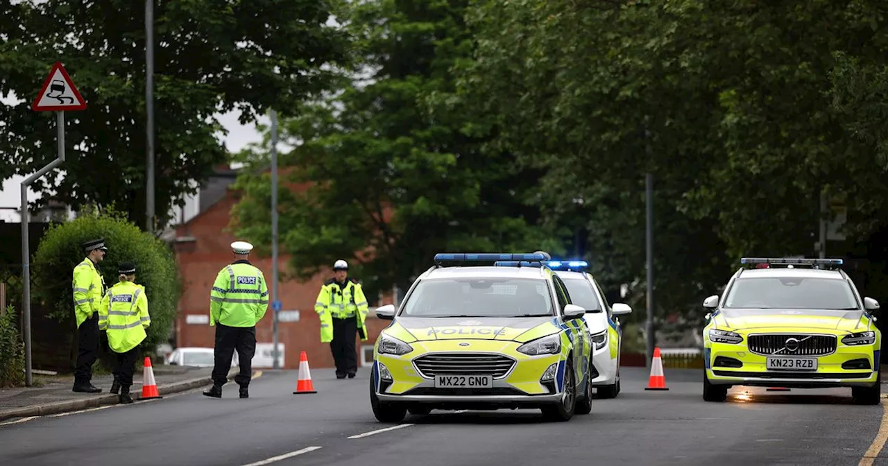 Road closed after unmarked GMP car involved in crash with officer in hospital