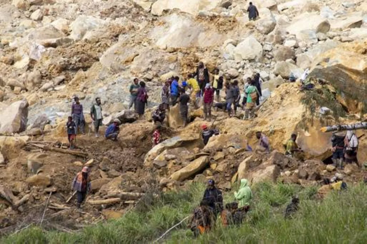 Authorities in Papua New Guinea search for safer ground for thousands of landslide survivors