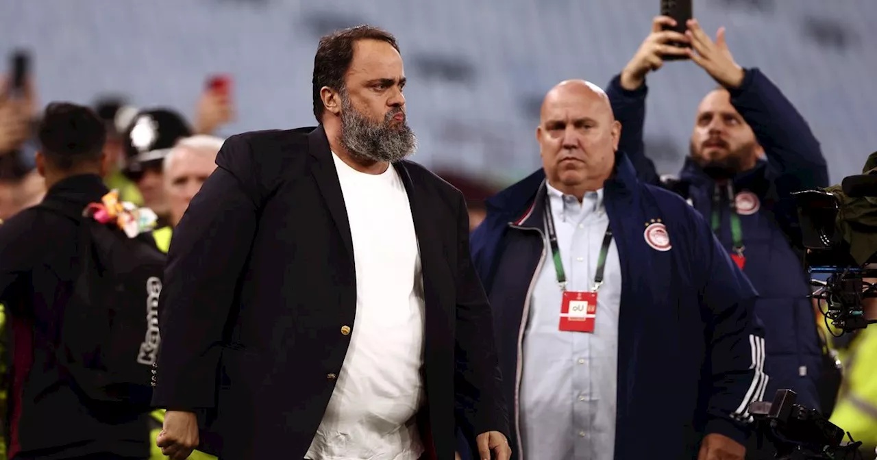 Evangelos Marinakis celebrates with Olympiacos away fans after Villa win