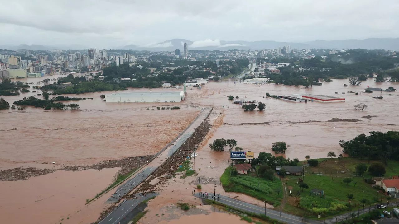 Dozens dead and roads turned into rivers as Brazil hit by record-breaking floods