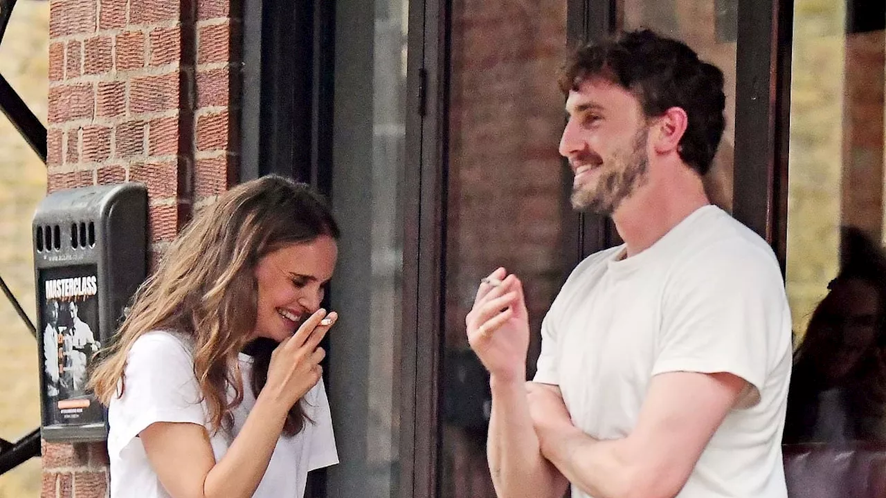 Newly-single Natalie Portman, 42, looks giddy with Paul Mescal, 28, as they get the giggles enjoying...