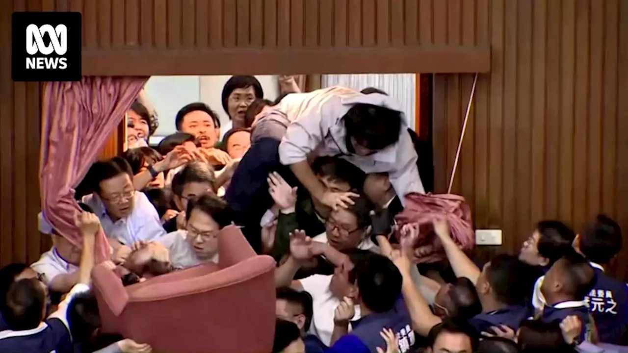 Why have Taiwan's politicians been brawling in parliament?