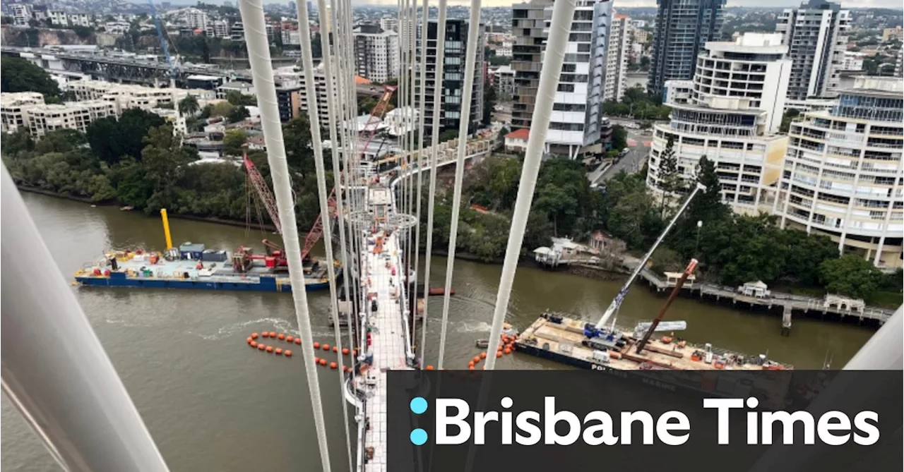 Kangaroo Point bridge a step closer to opening as final piece of deck slots into place