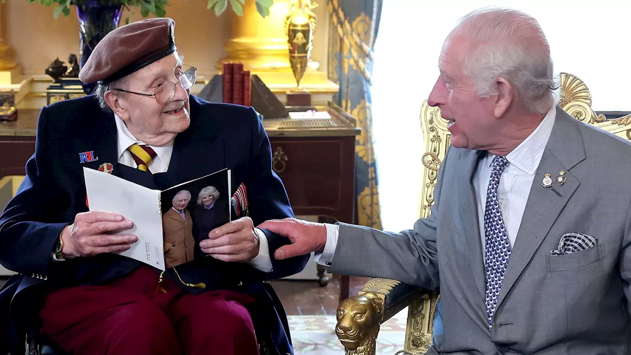 King presents D-Day veteran with 100th birthday card at Buckingham Palace