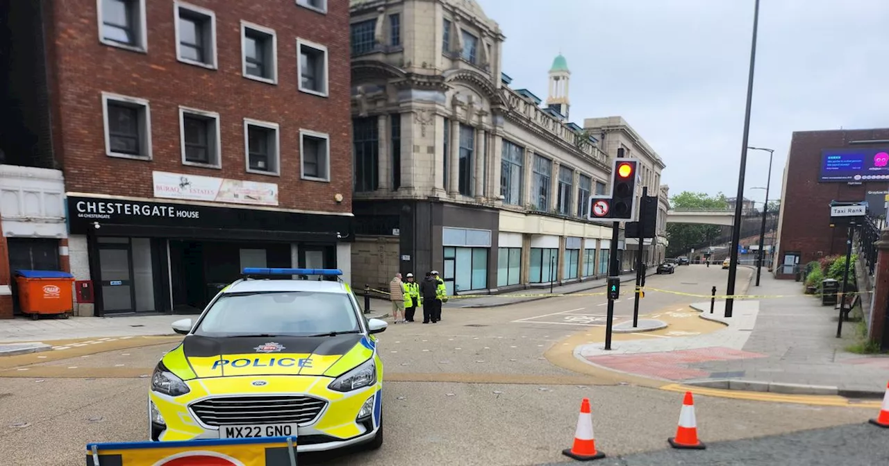 Man seriously injured in town centre crash before fire breaks out in building