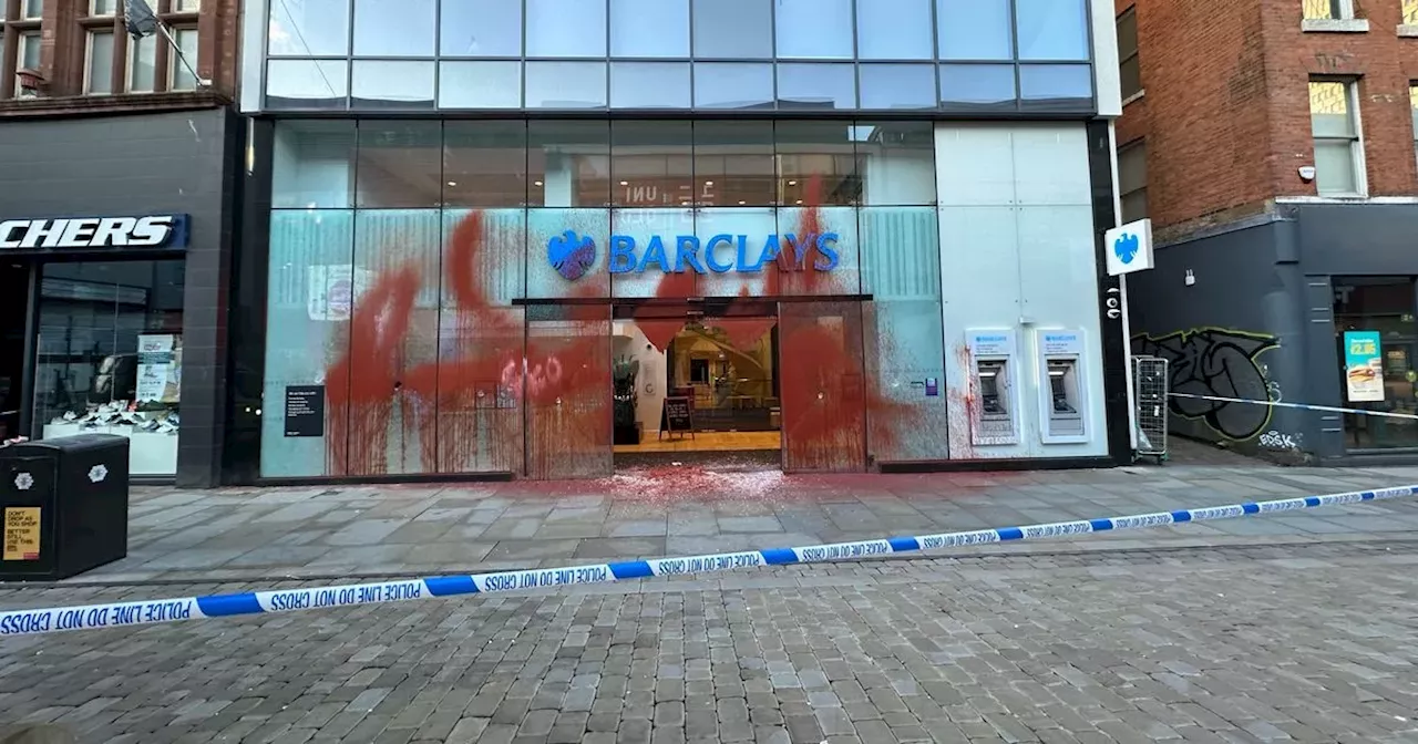 Police tape off Barclays as Manchester bank smashed up and covered in paint