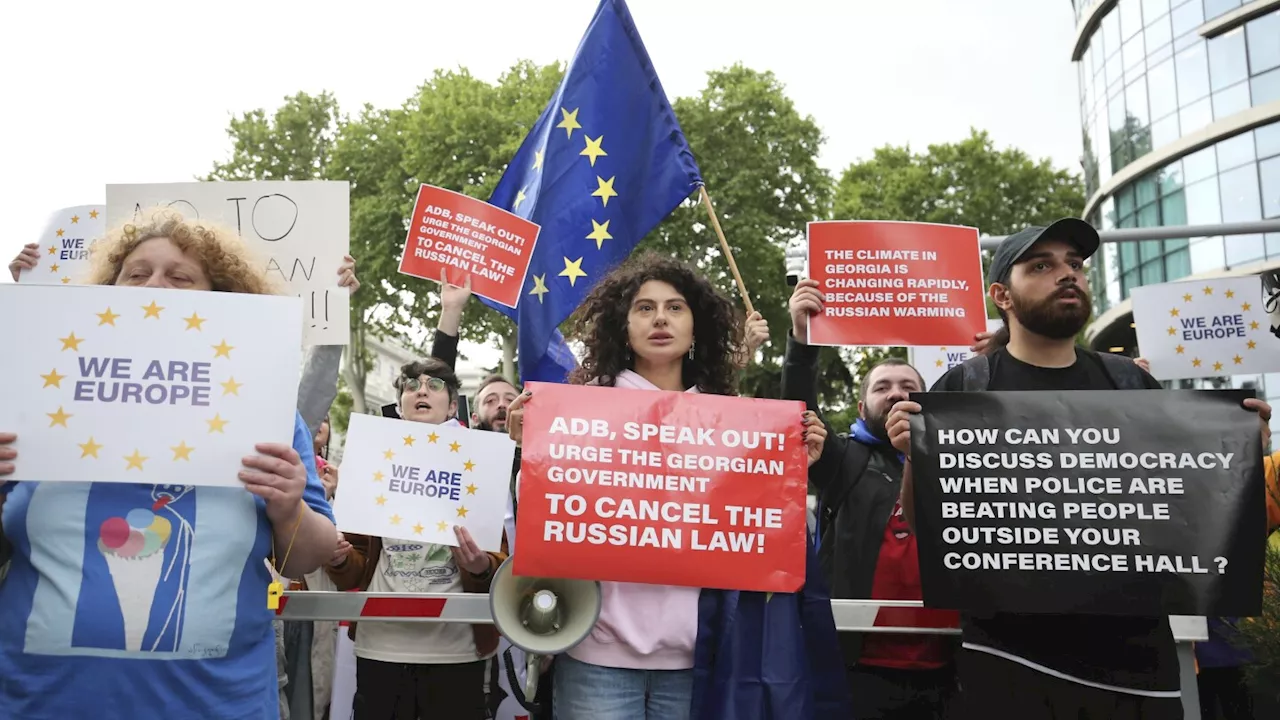 Georgian protesters against 'Russia-style' media law mark Orthodox Easter with candlelight vigil