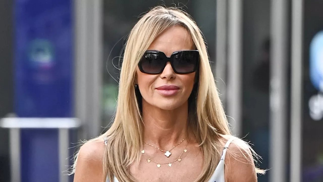 Amanda Holden sizzles as she displays toned legs in tiny mini dress