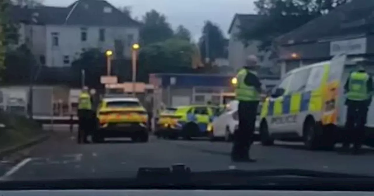 Police swarm Glasgow road after two men injured as six arrested in 'disturbance'