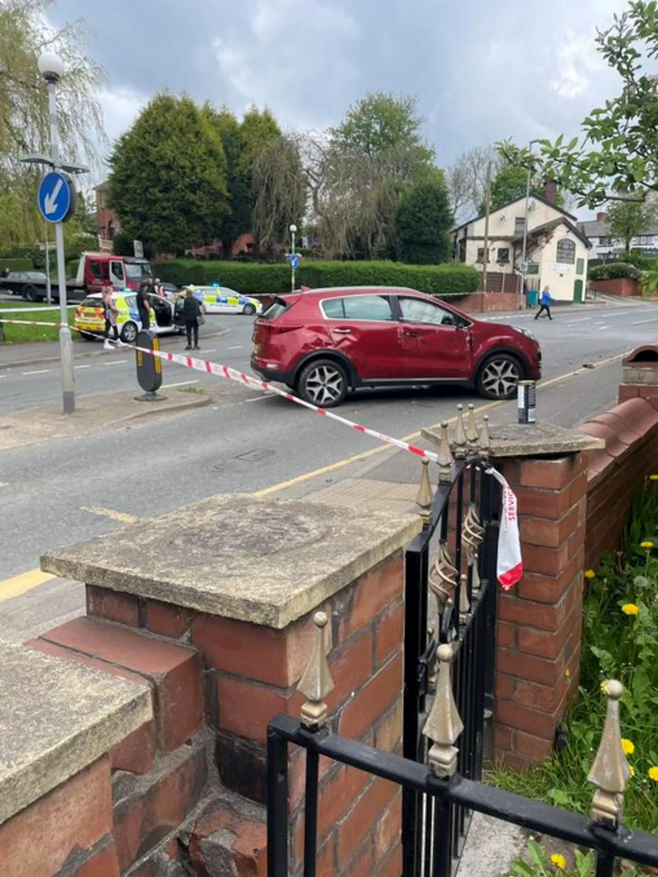 Two teenagers arrested after car 'used in robbery' crashes into parked cars