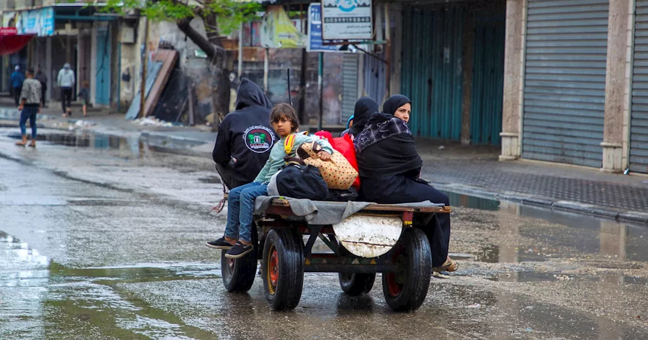 To background of bombs, Palestinians flee Rafah to seek shelter elsewhere once again