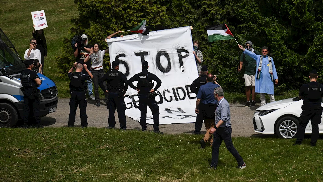 Pro-Palestine protesters spark outrage after massing at Auschwitz death camp during Holocaust Remembrance...