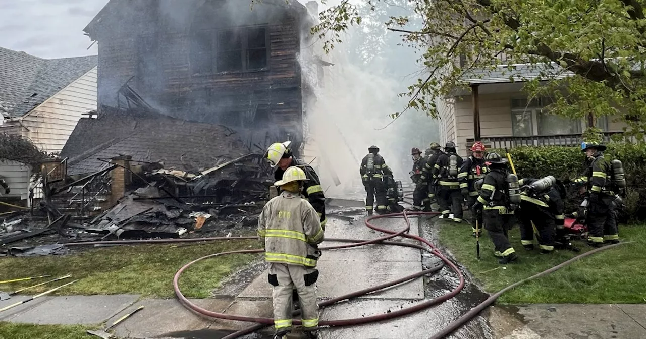 Good Samaritan rescues infant from Cleveland house fire; firefighter injured when porch collapses