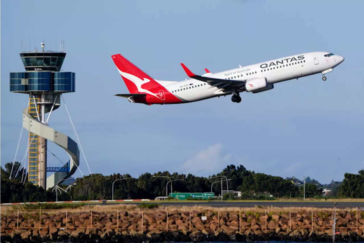 Qantas agrees to pay $79 million in compensation and a fine for selling seats on canceled flights