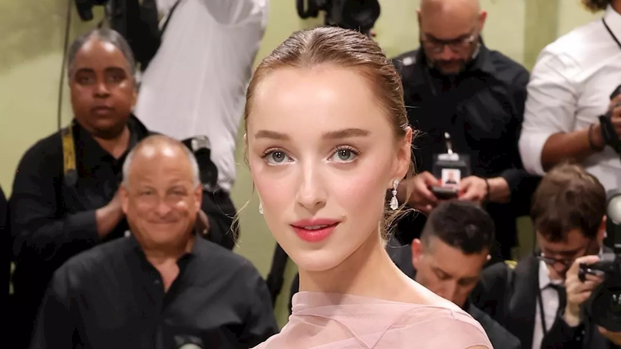 Phoebe Dynevor sparks engagement speculation after sporting diamond ring on her left hand at Met...