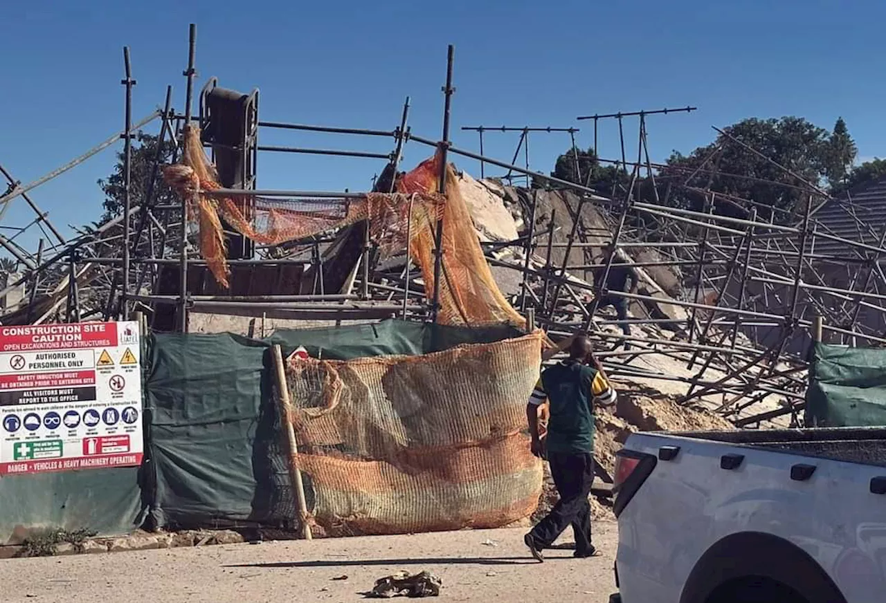 Race to free trapped workers after George building collapse