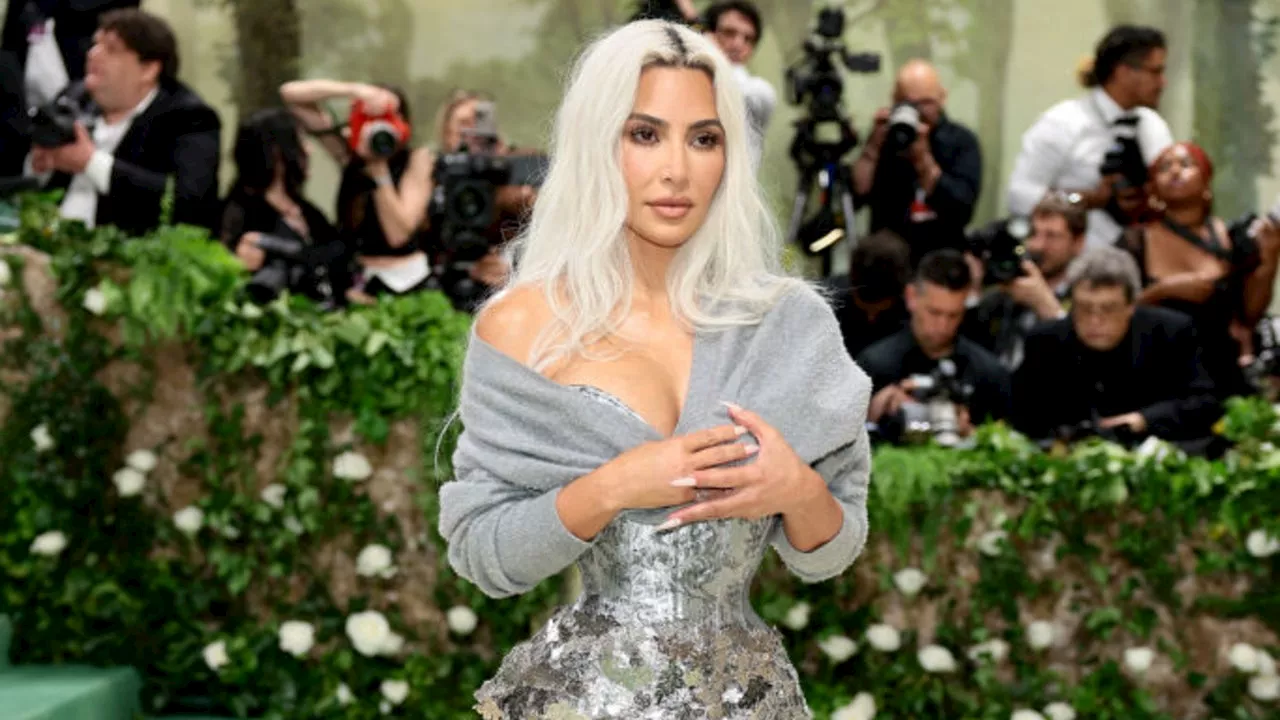 Kim Kardashian Shocks in Extreme Corset on Met Gala Carpet After Tom Brady Roast