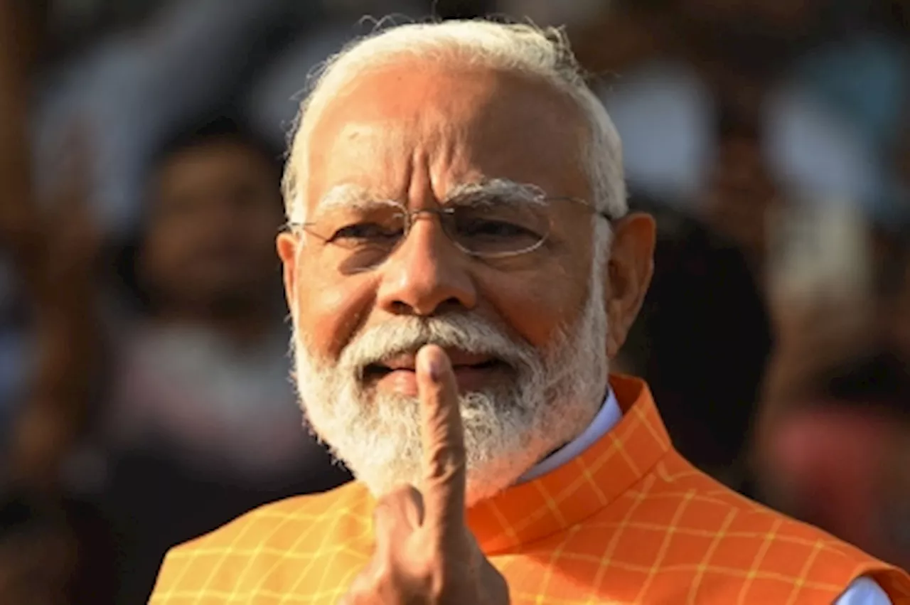 India’s Modi casts his vote as giant election reaches half-way mark