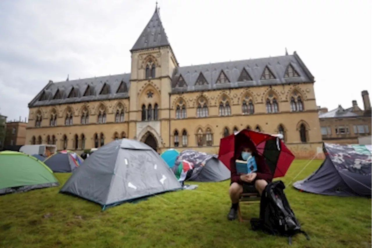 With bright tents and sombre mood, protesting UK students show solidarity with US peers