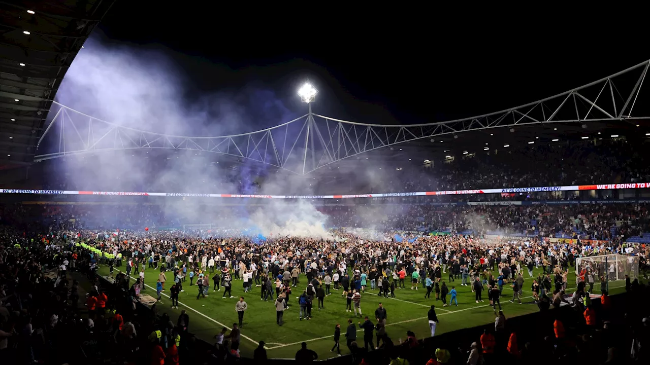 Bolton fans run on the pitch after Trotters see off Barnsley comeback to book place in League One play-off...