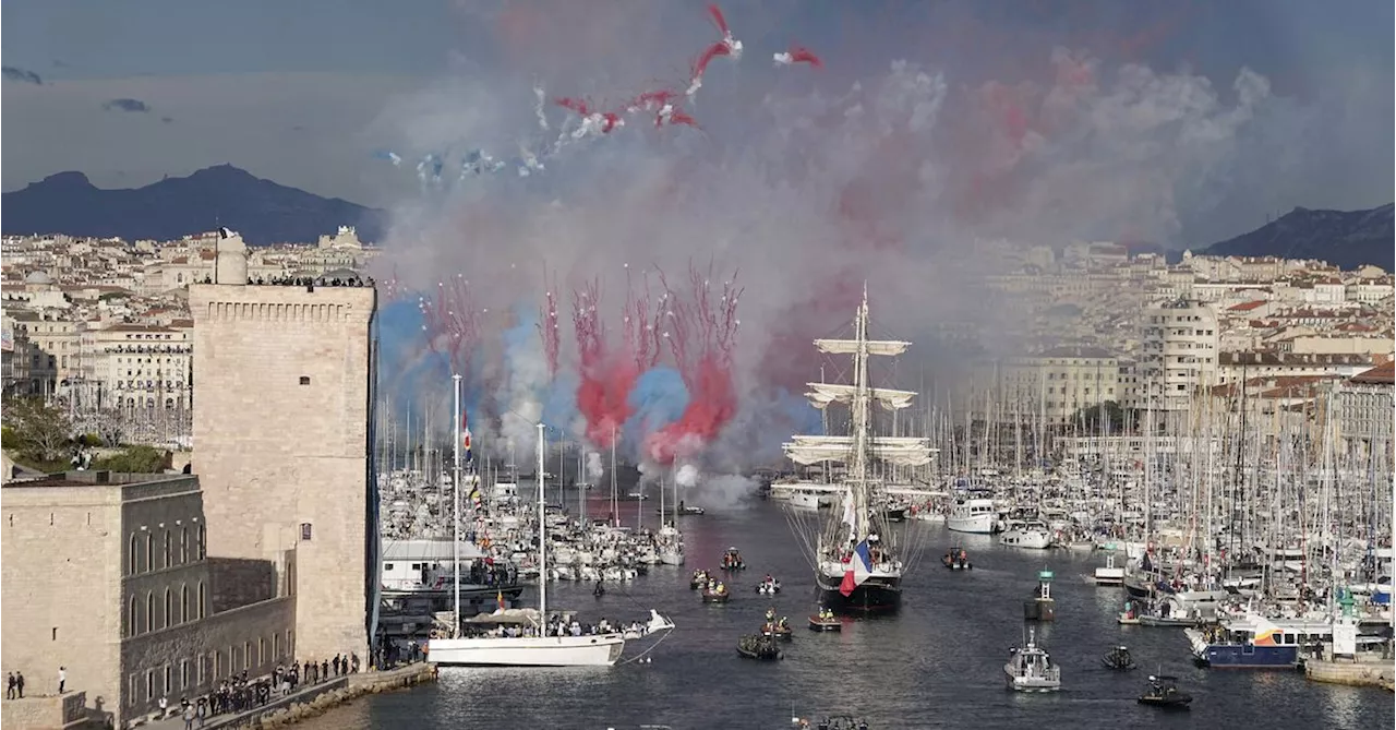 A ship carrying the Olympic torch arrives in Marseille amid fanfare and high security