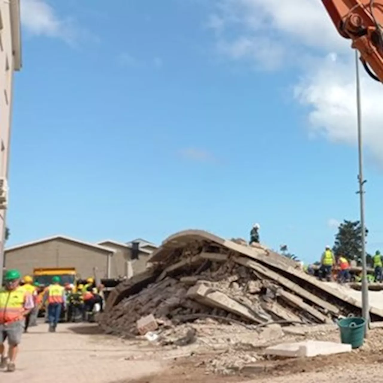 Voice calls out from under rubble at George building site