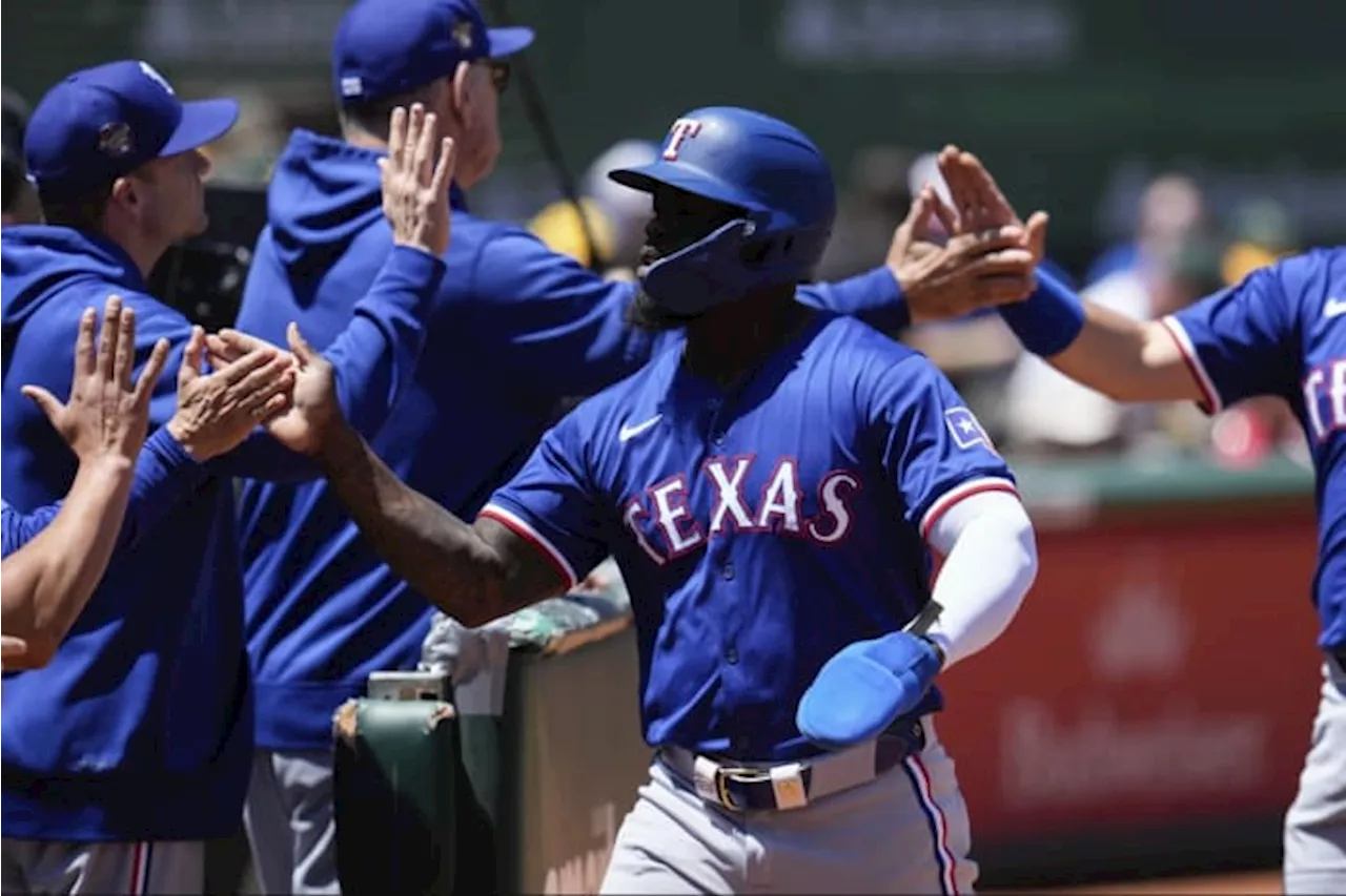 Texas Rangers score 10 runs in second inning, beat Oakland Athletics 15-8