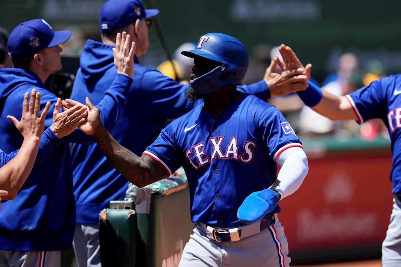 Texas Rangers score 10 runs in second inning, beat Oakland Athletics 15-8