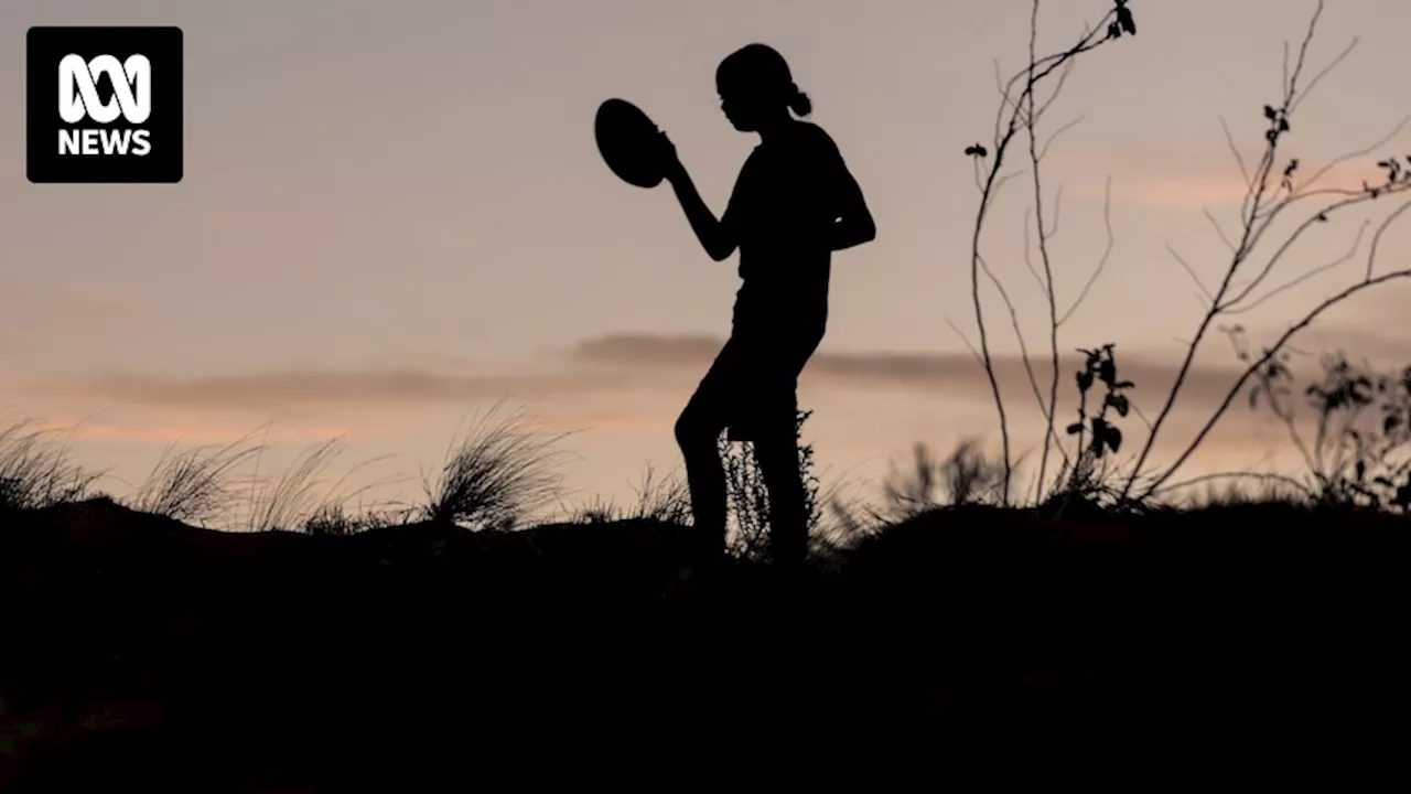 In the shadow of Uluru, a First Nations remote community football carnival gives rare opportunity for young women to play