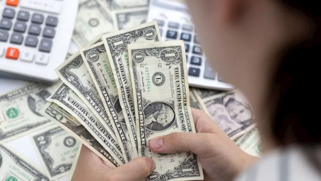 Dollar holds its ground as key inflation data looms