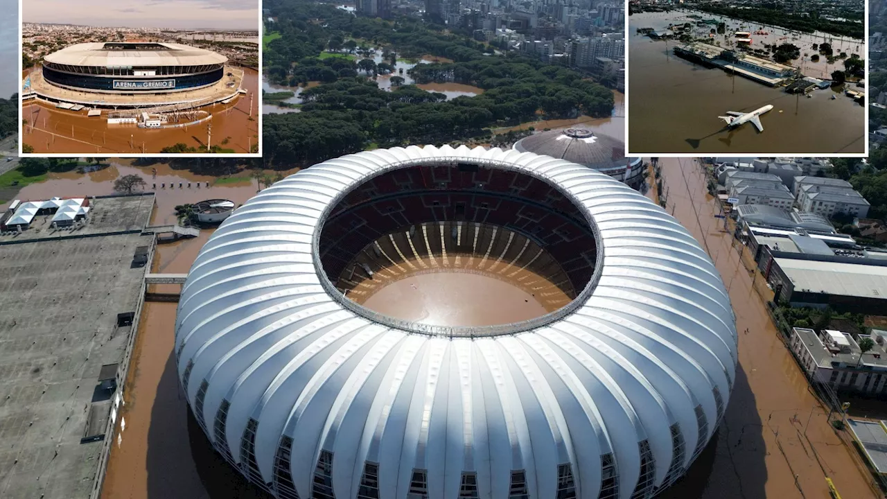 Video shows World Cup football stadium left flooded & ABANDONED after torrential rain swamps Brazil...