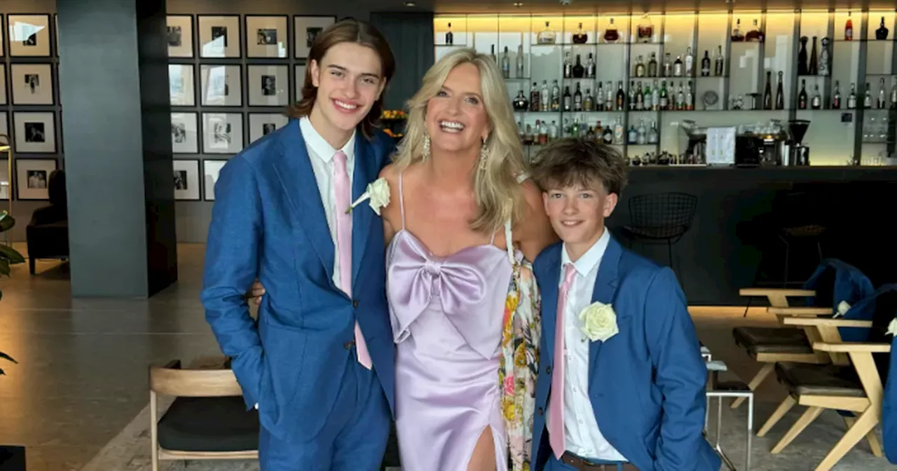 Penny Lancaster beams with pride as she poses with her sons at family wedding