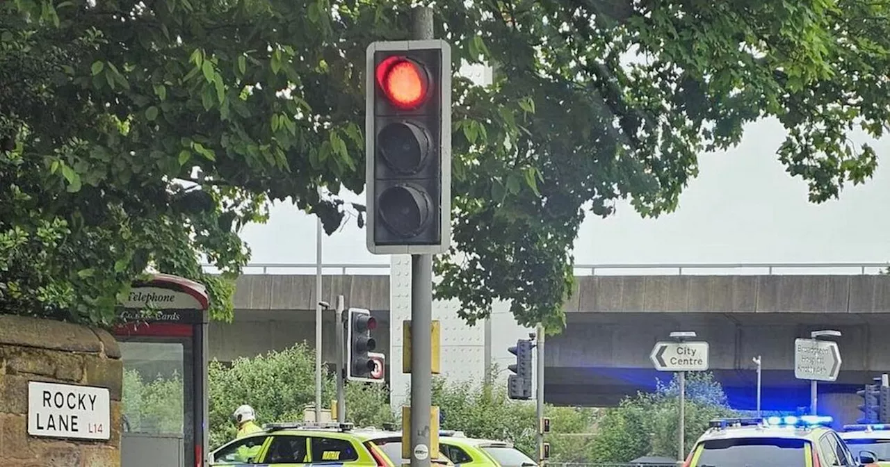 Road closed after car 'flip onto its roof' during crash