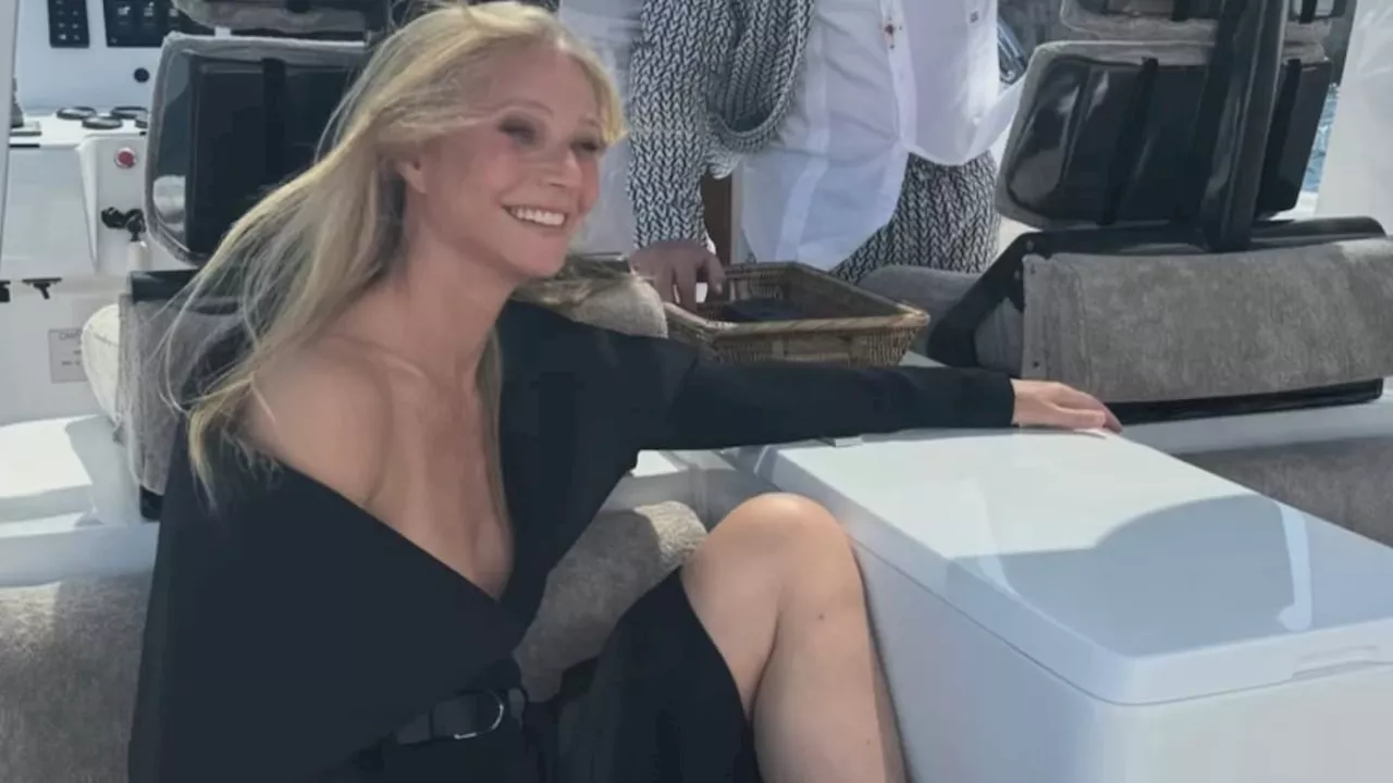 Gwyneth Paltrow's dress almost falls OFF her shoulders as she goes bra-free while looking happier...