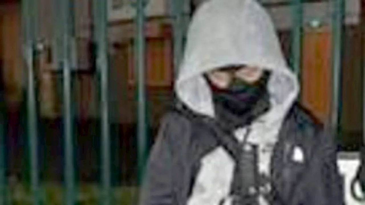 Pictured: Machete murderer, 12, poses with 16-inch knife tucked into his trousers just hours before...