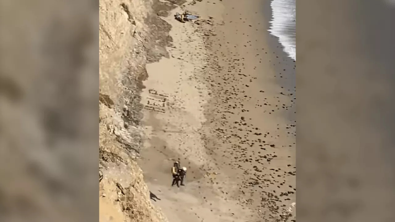 Stranded windsurfer rescued after spelling out ‘HELP' on Santa Cruz-area beach