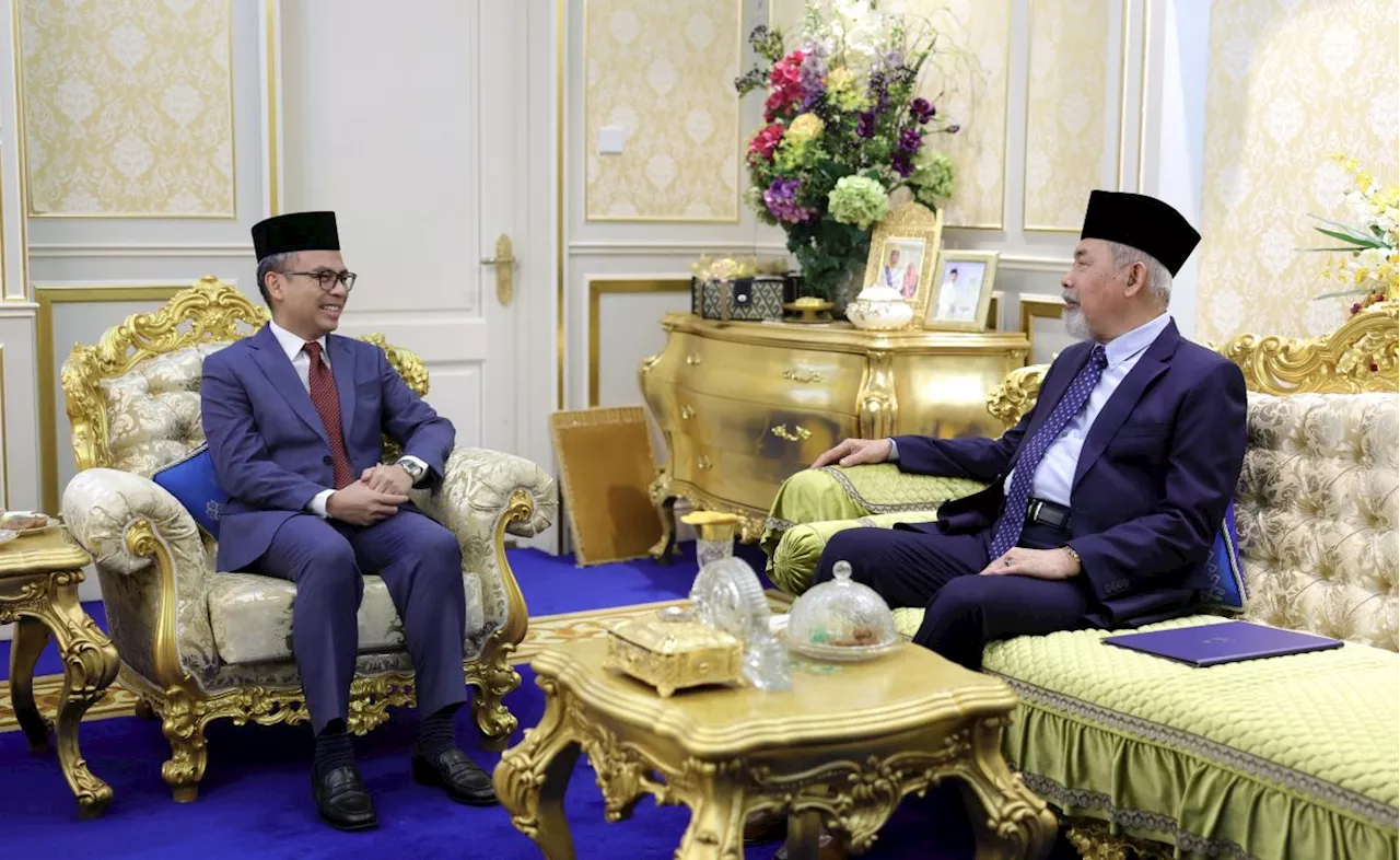 Fahmi presents instrument of royal invitation to Sabah governor for King’s coronation